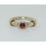 A 925 silver and 18K gold ring with pink stone to centre, Size G