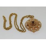 Large 9ct gold Victorian locket and chain set with pearls and central garnet