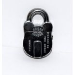 A silver plated vesta case in the form of a lock.