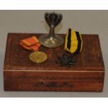 Polish WWII medal and an 1896 Ashanti Star in a carved wooden box