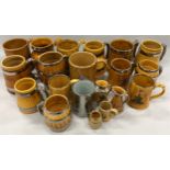 A large collection of ceramic tankards.