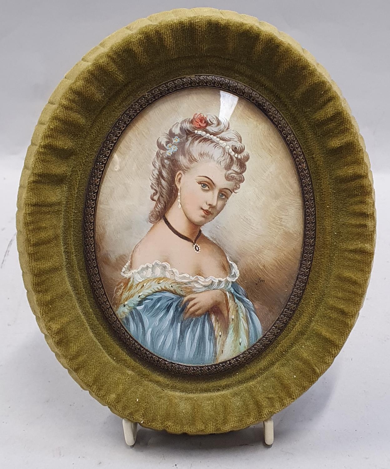 Elegant miniature portrait of a lady in a curved glass velvet frame (possibly on bone or ivory).