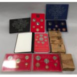 A collection of coin proof sets together with four medal boxes.