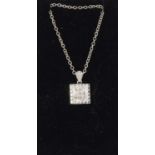An 18ct white gold diamond pendant necklace with diamond bale.