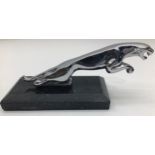 Mounted Jaguar on onyx plinth.