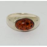 A 925 silver ring with amber stone to centre. Size U