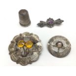 Three items of silver jewellery (Scottish Silver) and a silver thimble by Charles Horner.