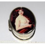 A silver pill box with enamel nude image to lid.