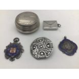 A bag of solid silver items to include Pill Box, Stamp Case, 2 football fobs (enamel) and a Scottish