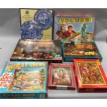 Collection of vintage jigsaw puzzles complete with boxed amazing robot game.