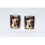 A pair of silver and enamel cufflinks with nude female images