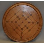 Vintage round wooden breadboard with inlaid Twelve Mans Morris game