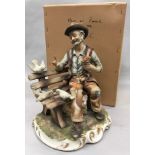 Capodimonte figure of an old man seated on a bench feeding birds 33cm in height.