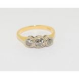 Three stone approx. 0.70 point Diamond rub over mounted 18ct gold ring, Size P