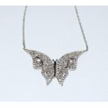 A silver and CZ butterfly necklace.