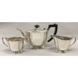 A solid silver Chester hallmarked three piece teaset (1085gm)