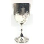 A solid silver Victorian wine goblet with foliage decoration and blank car-touche, London Hallmark.