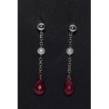 A pair of white gold ruby and pearl drop earrings.