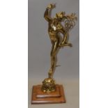 Superb Victorian large brass mercury figure standing 23" tall on a two tier wooden plinth.