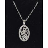 A white gold and diamond set pendant necklace.
