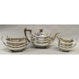 A solid silver three piece Georgian teaset, London hallmark, dated 1807 (1005gm)