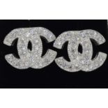 A pair of silver and CZ Channel style Stud earrings.