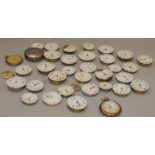 A box of vintage mechanical pocket watch movements