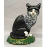 Cast metal door stop in shape of a Cat