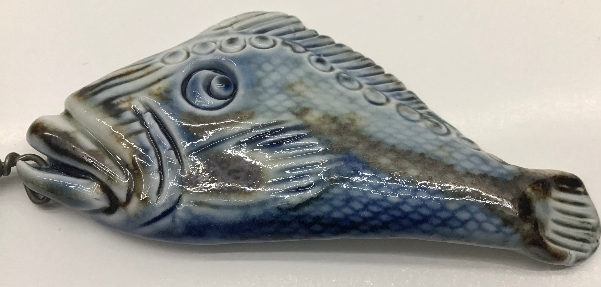 Poole Pottery interest Guy Sydenham pendant depicting a fish marked to reverse. - Image 2 of 3