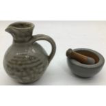 Poole Pottery interest Guy Sydenham miniature Pestle & Mortar together with a small jug (2)