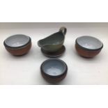 Poole Pottery interest Guy Sydenham sauce boat & stand together with three bowls all fully marked (