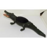 A cold painted bronze alligator pin cushion.