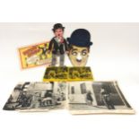 Charlie Chaplin ephemera to include two 8mm films, "Dancing Charlie" and assorted photographs.