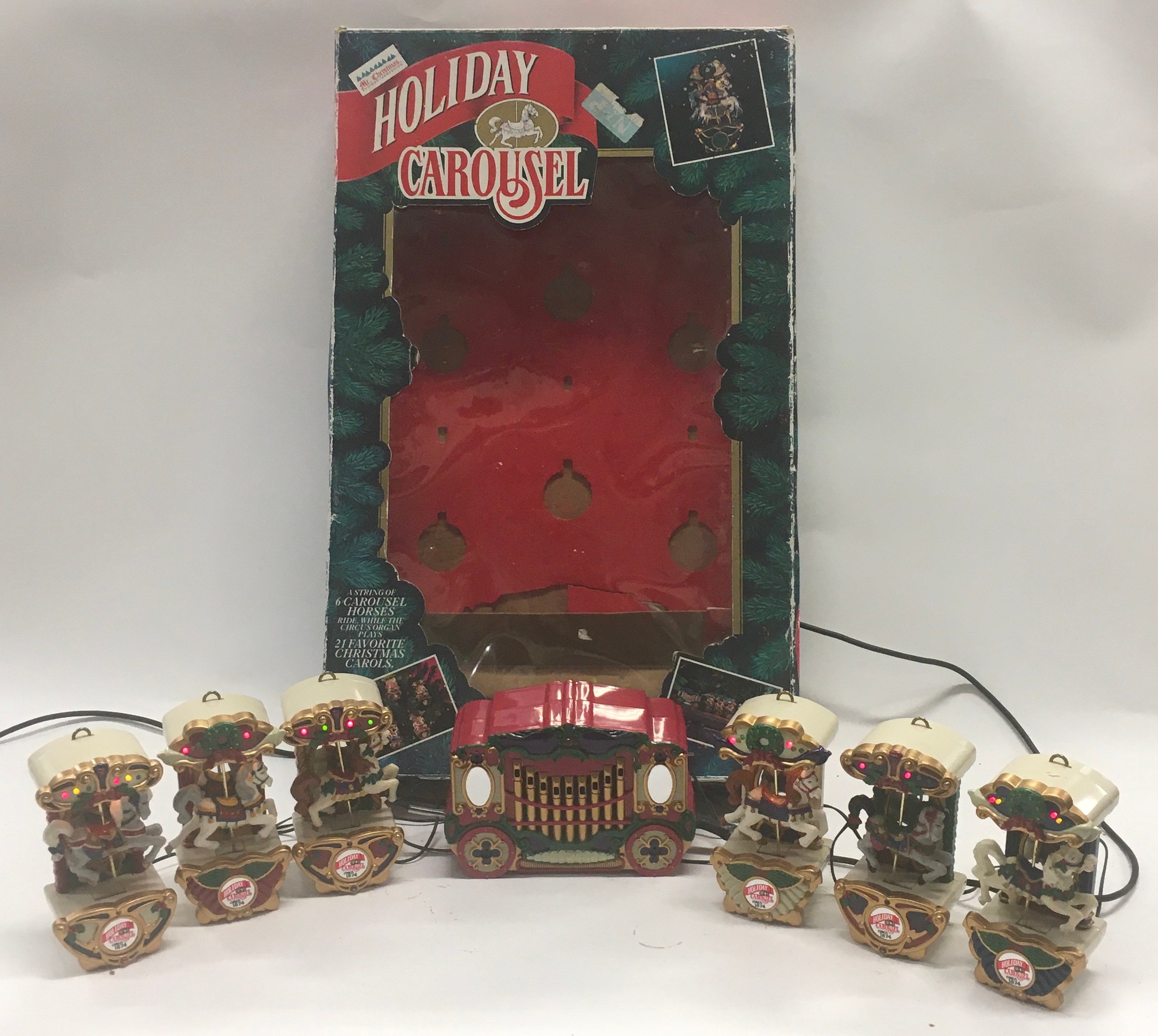 Mr. Christmas vintage Holiday Carousel plays 21 Christmas carols, boxed, good working condition.