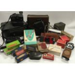 Large collection of various vintage cameras and accessories.