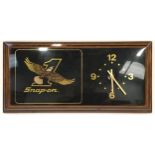 An advertising "Snap-On" wall clock 58x28cm.