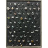 69 Fashion rings on tray. (C1)