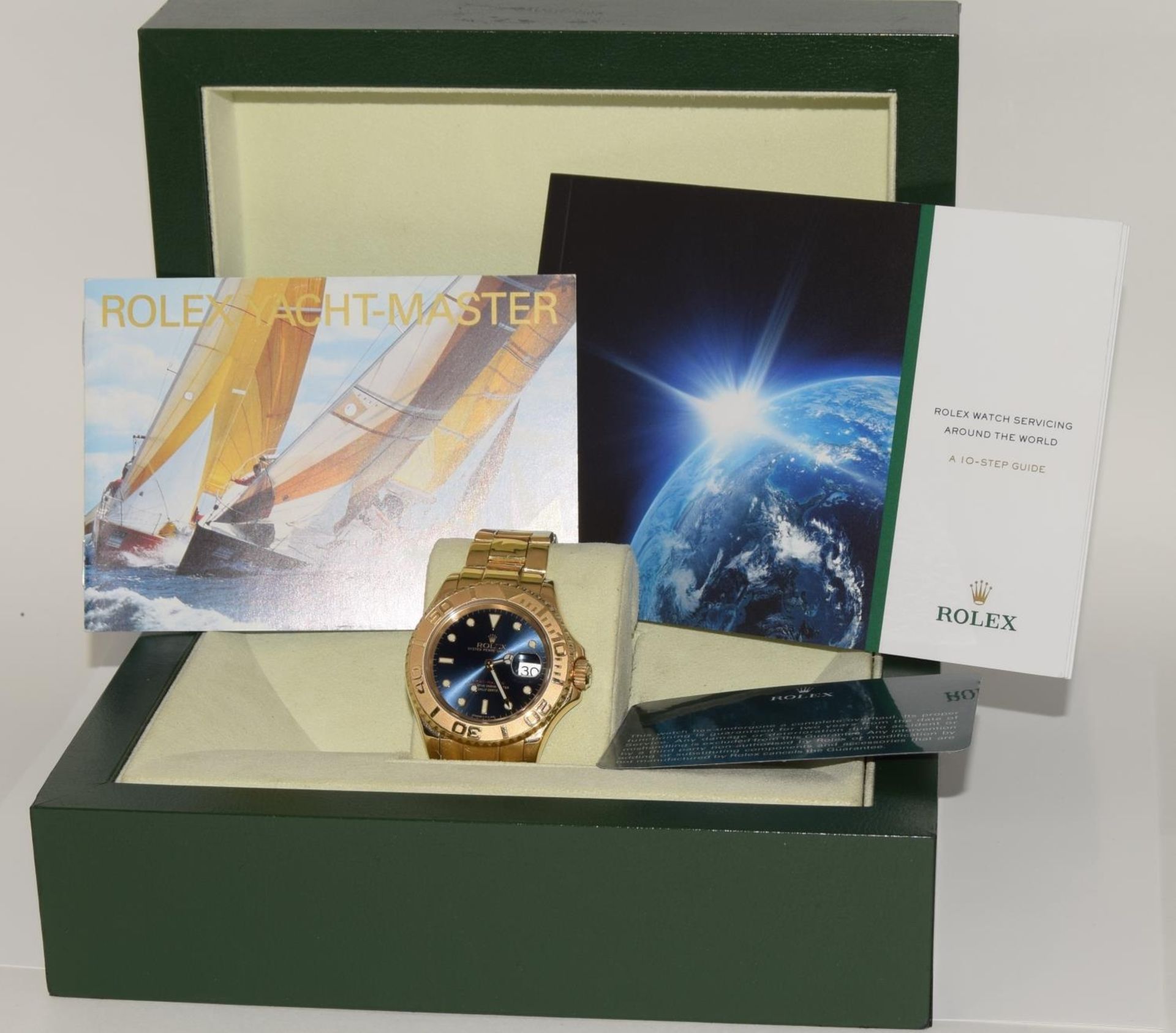 Rolex Yachtmaster 18ct gold model 16628. Electric blue face with Rolex service card and boxed. (