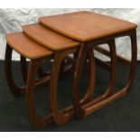 Parker Knoll nest of three teak 1970's occasional tables the largest measuring 53x52x51cm.
