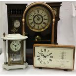 A box of assorted clocks to include four glass clocks.