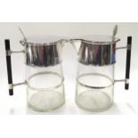 Pair of silver plated and cut glass claret jugs - the hunged covers inscribed - designed by Doctor C