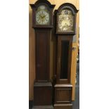 Two grandmother clocks.