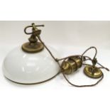 Vaseline glass hanging light fixture with brass pulley's.