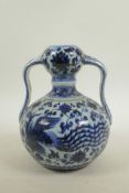 A Chinese blue and white porcelain garlic head vase, decorated with a phoenix and lotus flowers, six