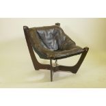 A stained wood frame easy chair with chrome mounts and suspended buttoned leather seat, late C20th