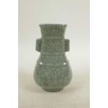 A Chinese celadon crackleglazed pottery vase with two lug handles, mark to base, 6½" high