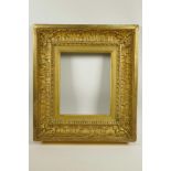 A C19th gilt composition picture frame, with leaf and scroll decoration, rebate 10" x 8¼"