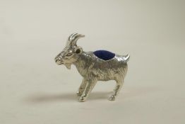 A sterling silver pincushion in the form of a goat, 1" long