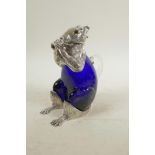 A silver plated and blue glass claret jug in the form of a squirrel, 7" high