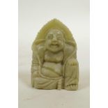 A Chinese carved soapstone Buddha, 2½" high